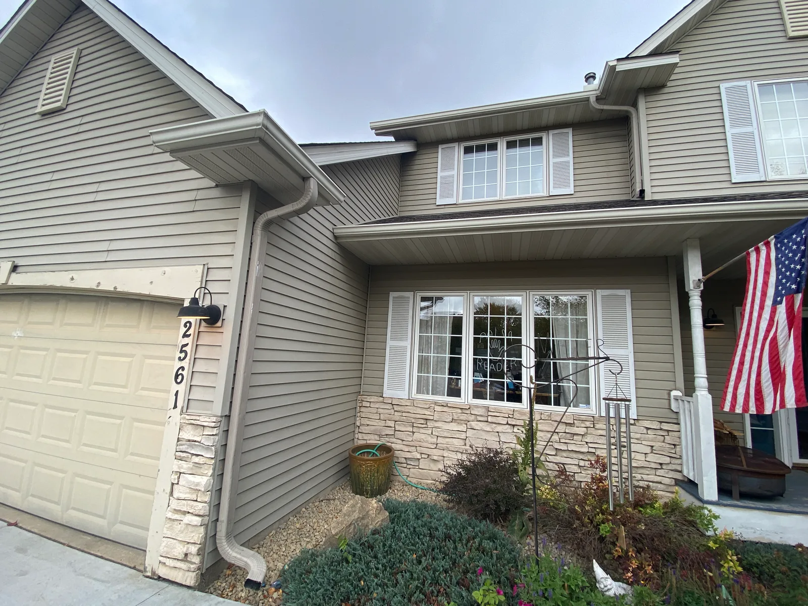 Before — the garage and front entry.