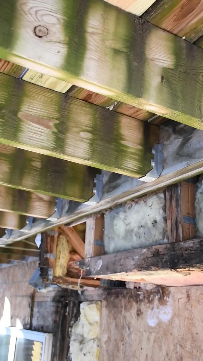 Inspection detail — the wall near the deck connection.