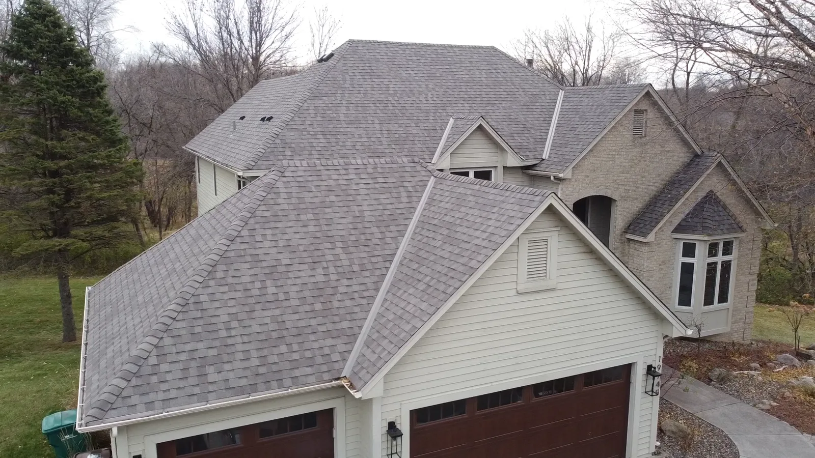 After — replacement roof above the garage and entry.