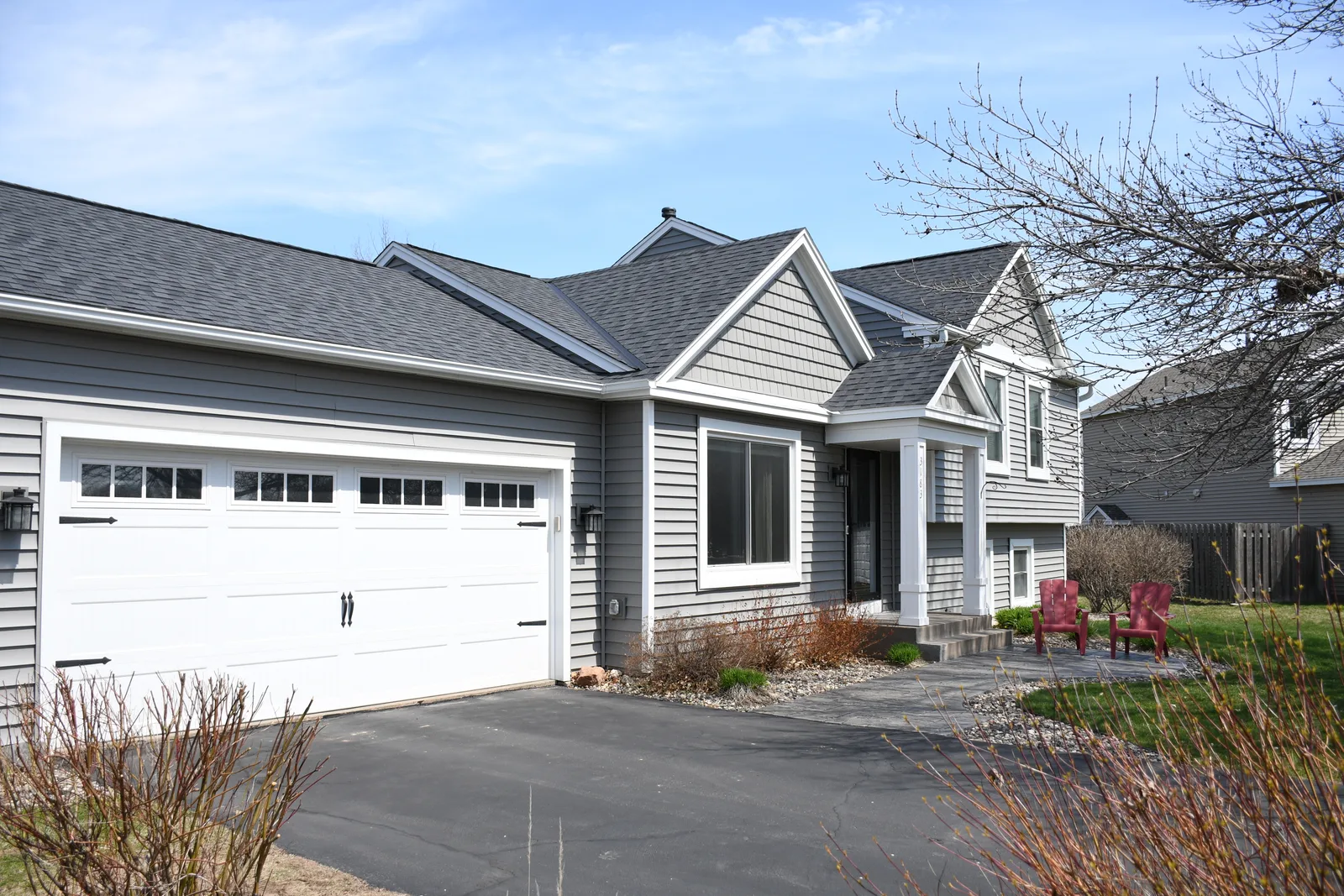 After — siding and trim around the garage and entry.